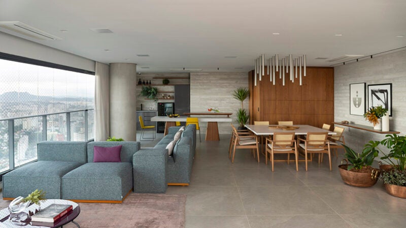 Concreto aparente dá o tom em projeto de apto com traço modernista, contemporâneo e essência acolhedora